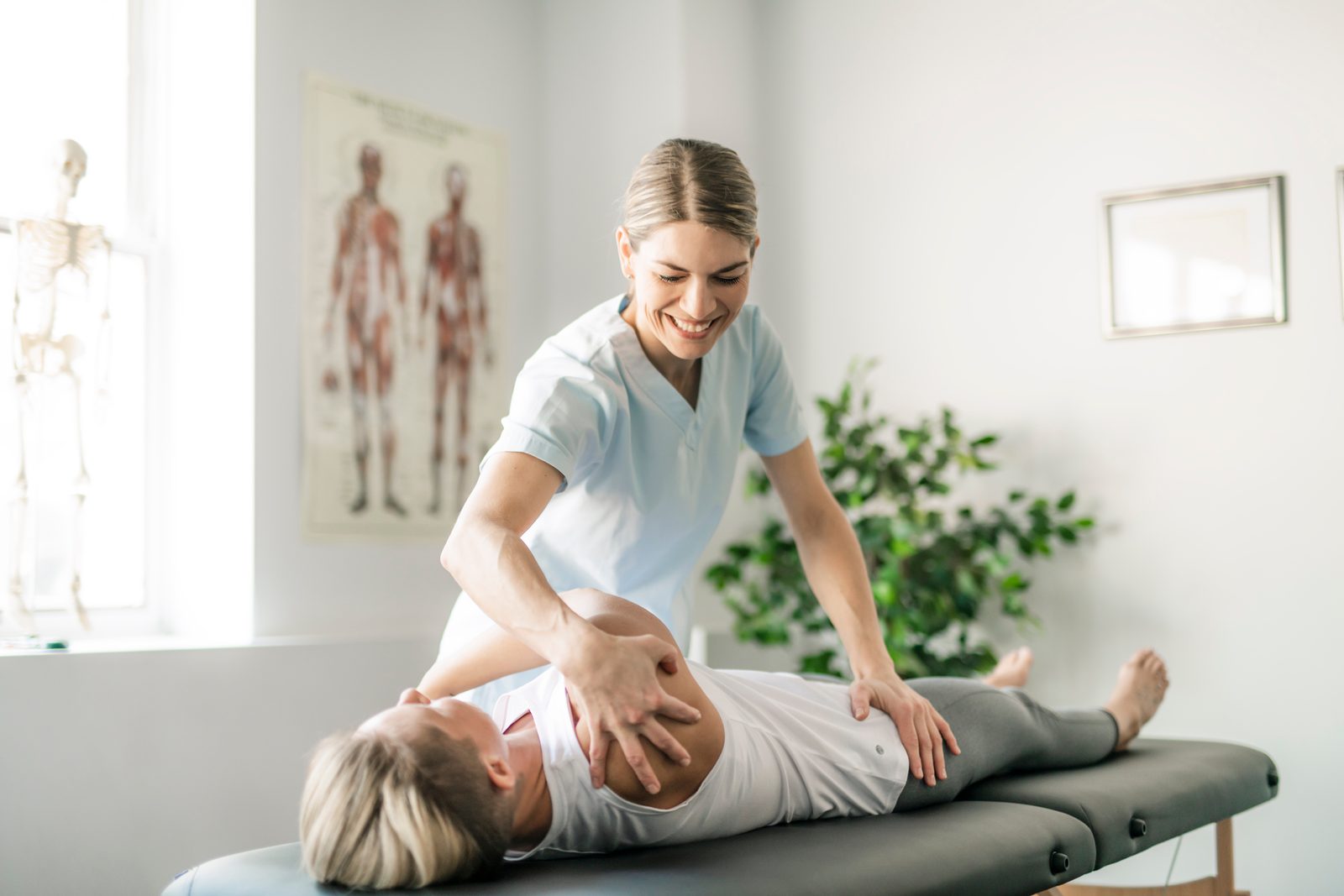 Expert manual therapist providing joint mobilization treatment